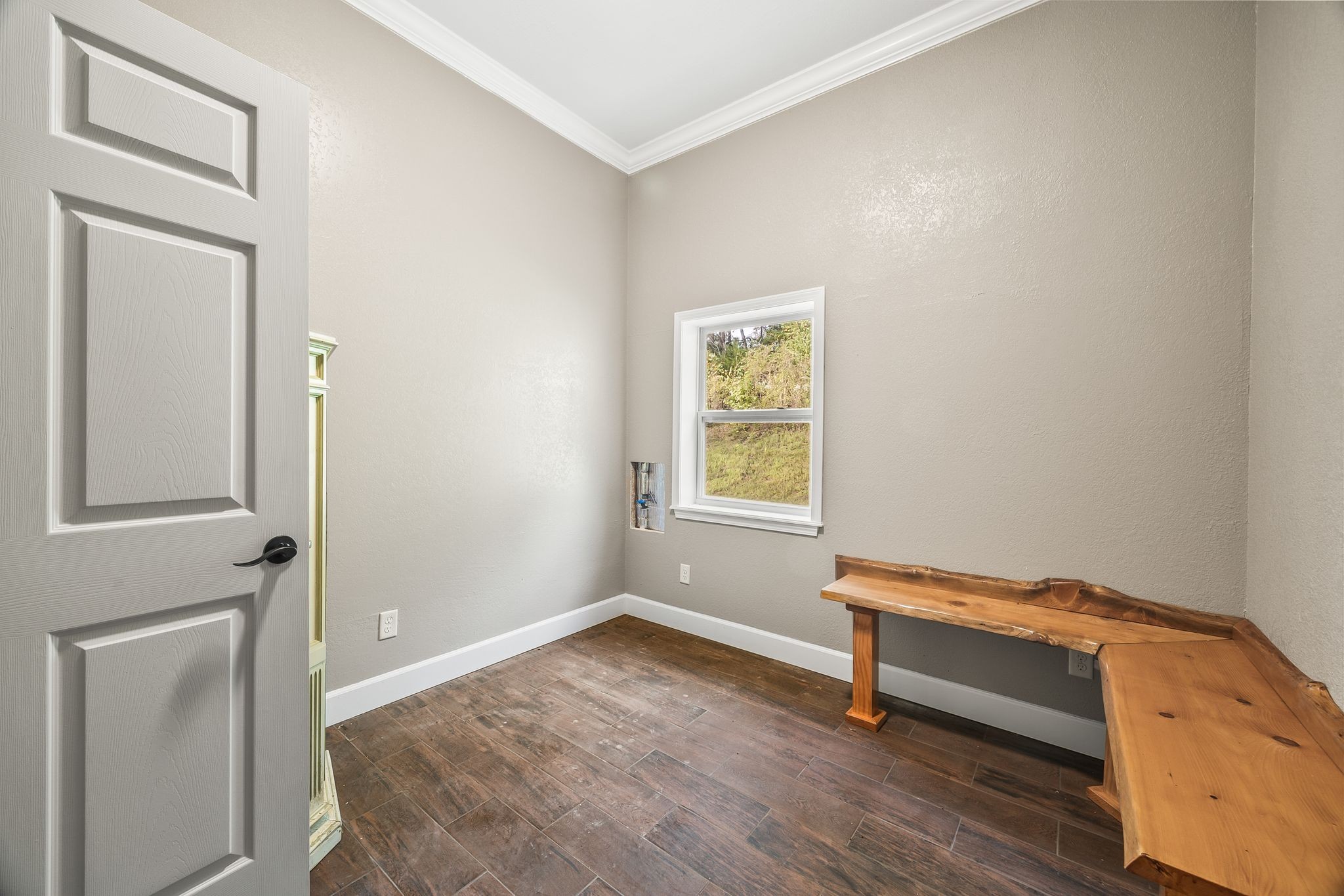 1582 Hellsneck Road Waverly, TN 37185 - Photo 40 of 72 a view of room with window and wooden floor