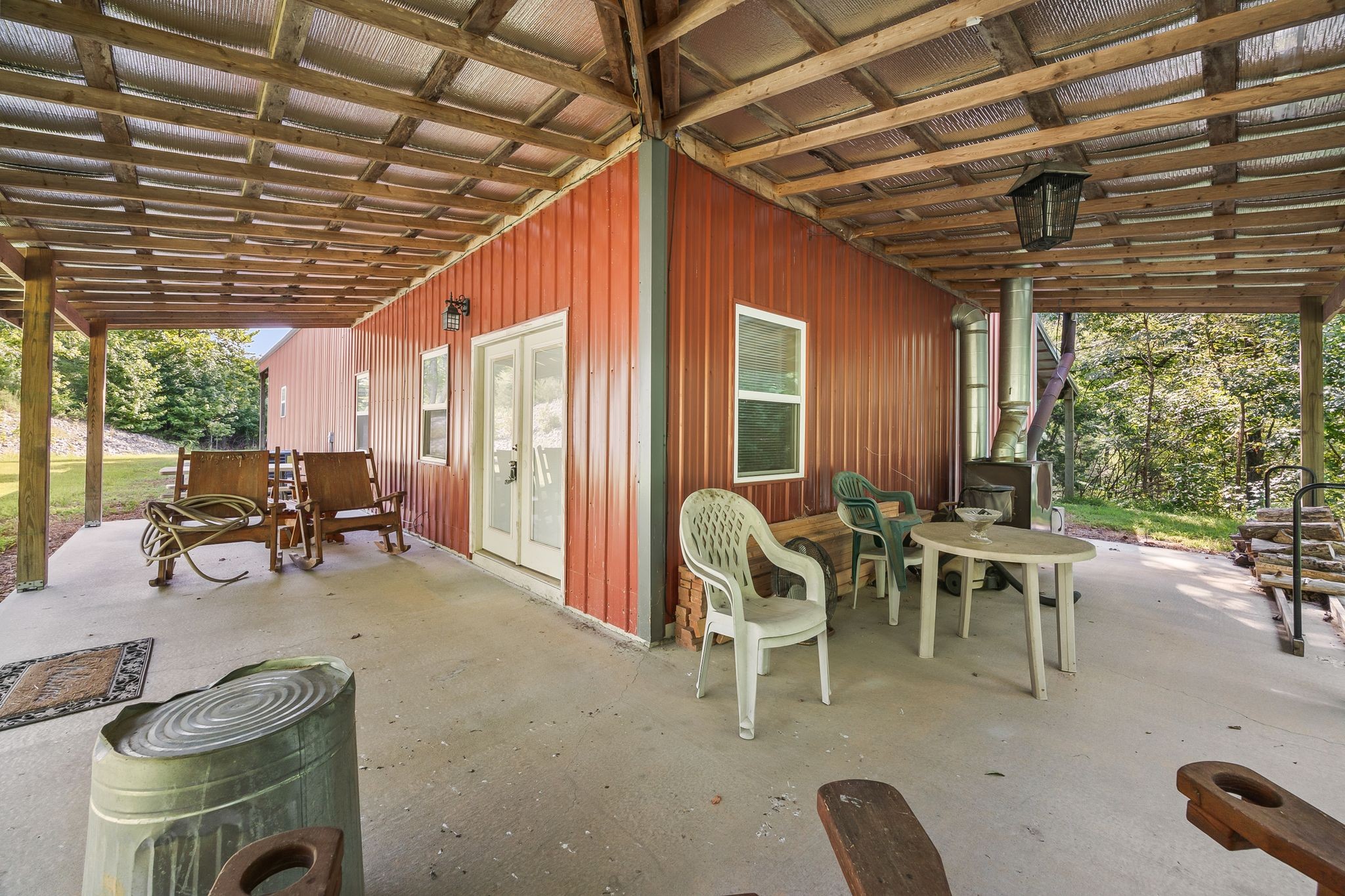 1582 Hellsneck Road Waverly, TN 37185 - Photo 4 of 72 a view of a dinning table and chairs in patio