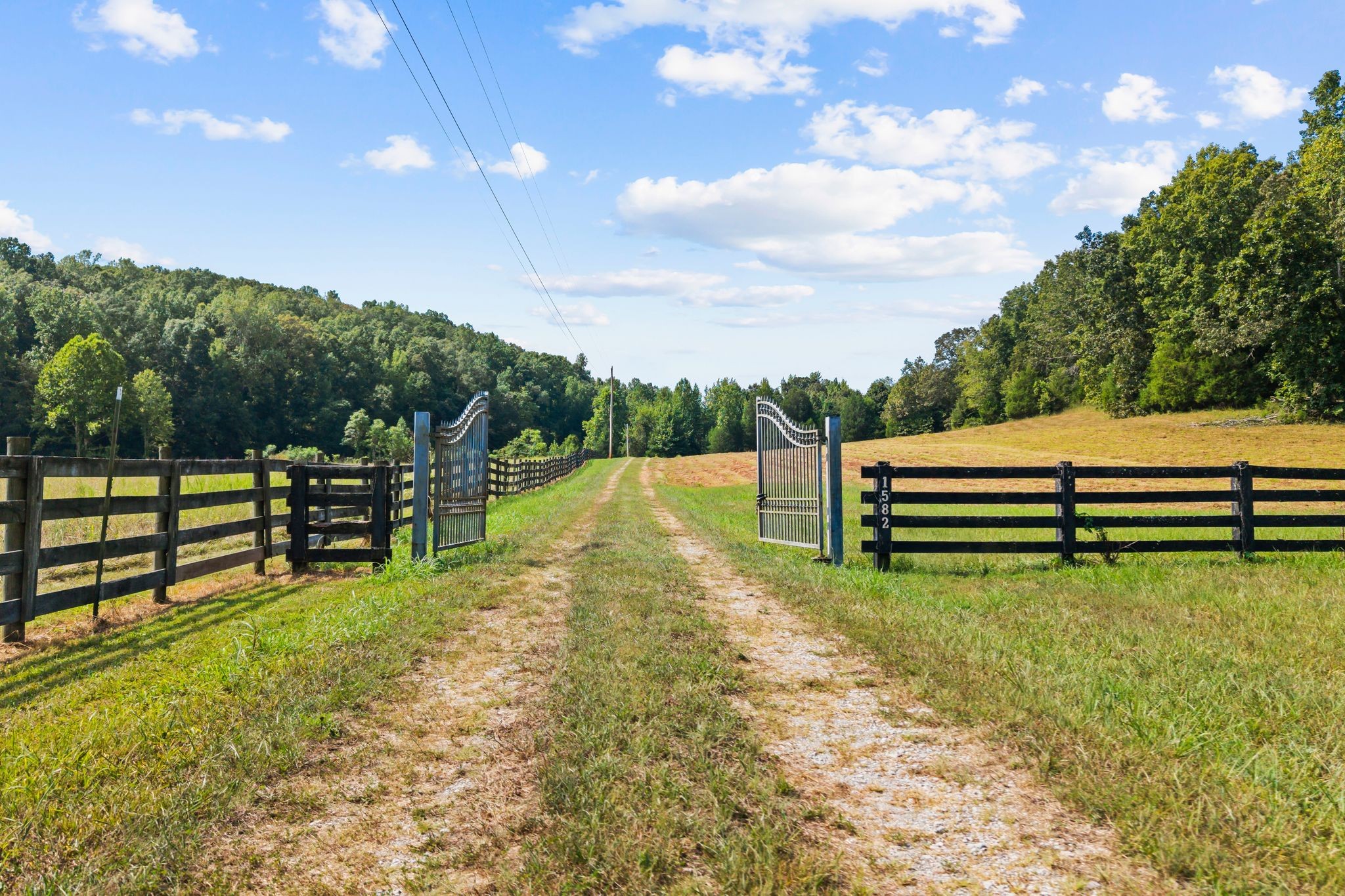 1582 Hellsneck Road Waverly, TN 37185 - Photo 68 of 72 a backyard of a house with lots of green space and outdoor seating