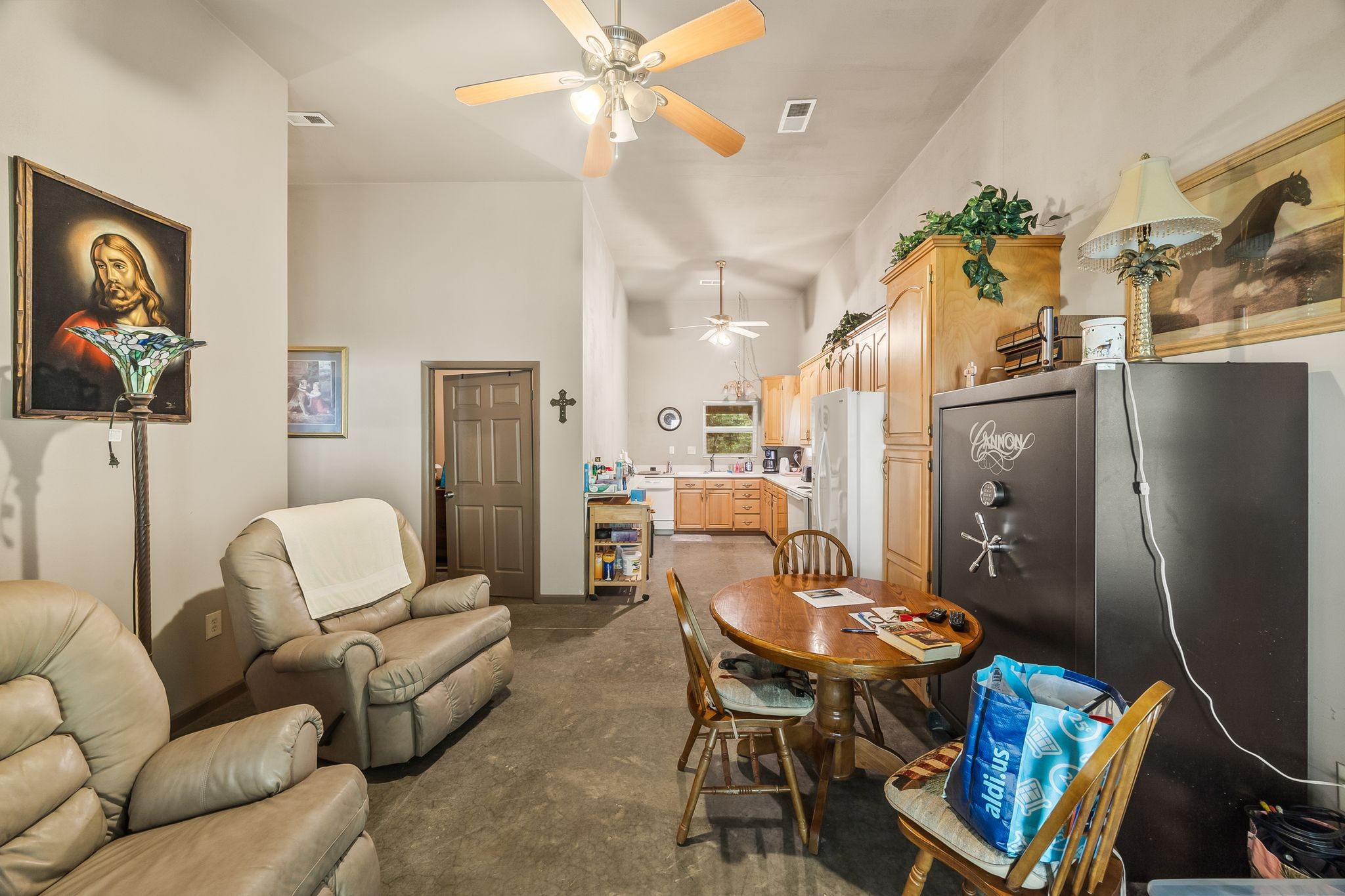 1582 Hellsneck Road Waverly, TN 37185 - Photo 9 of 72 a living room with furniture a fireplace and a chandelier