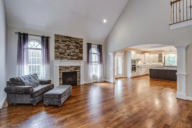 a large kitchen with stainless steel appliances granite countertop a large counter top a sink and a stove