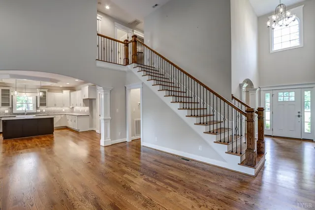 a kitchen with kitchen island granite countertop a sink a counter space appliances and cabinets