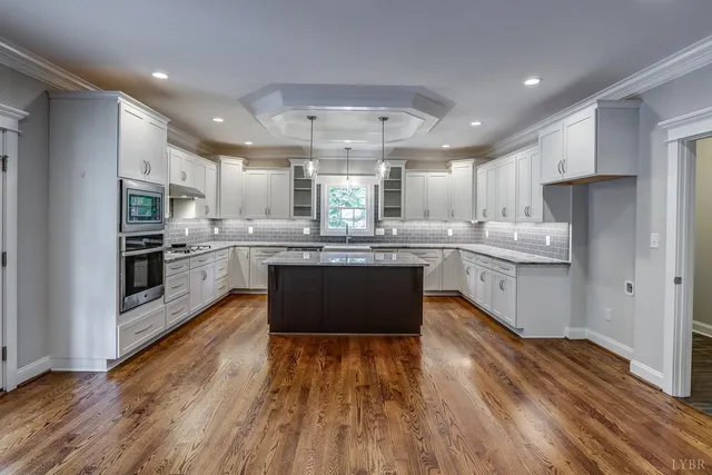 a bath tub sitting in a bathroom next to a window