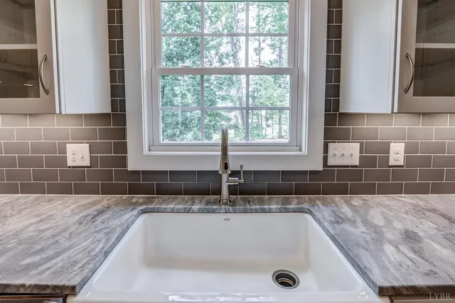 a white bath tub sitting in a bathroom