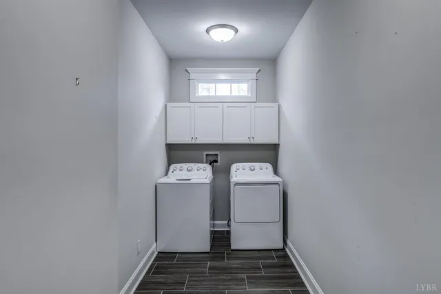 a bathroom with a double vanity sink toilet and shower