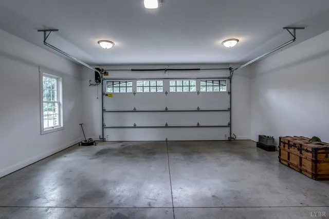 a spacious bedroom with a bed and wooden floor