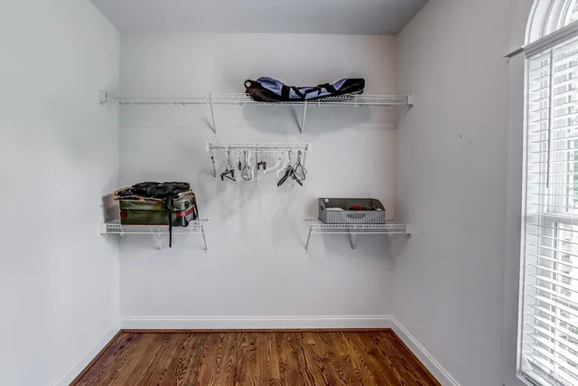 an aerial view of a house with a yard basket ball court