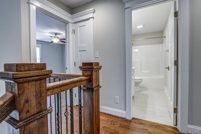 an aerial view of residential house with outdoor space and trees all around