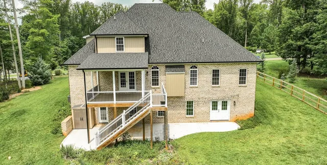 a view of a livingroom with wooden floor and stairs