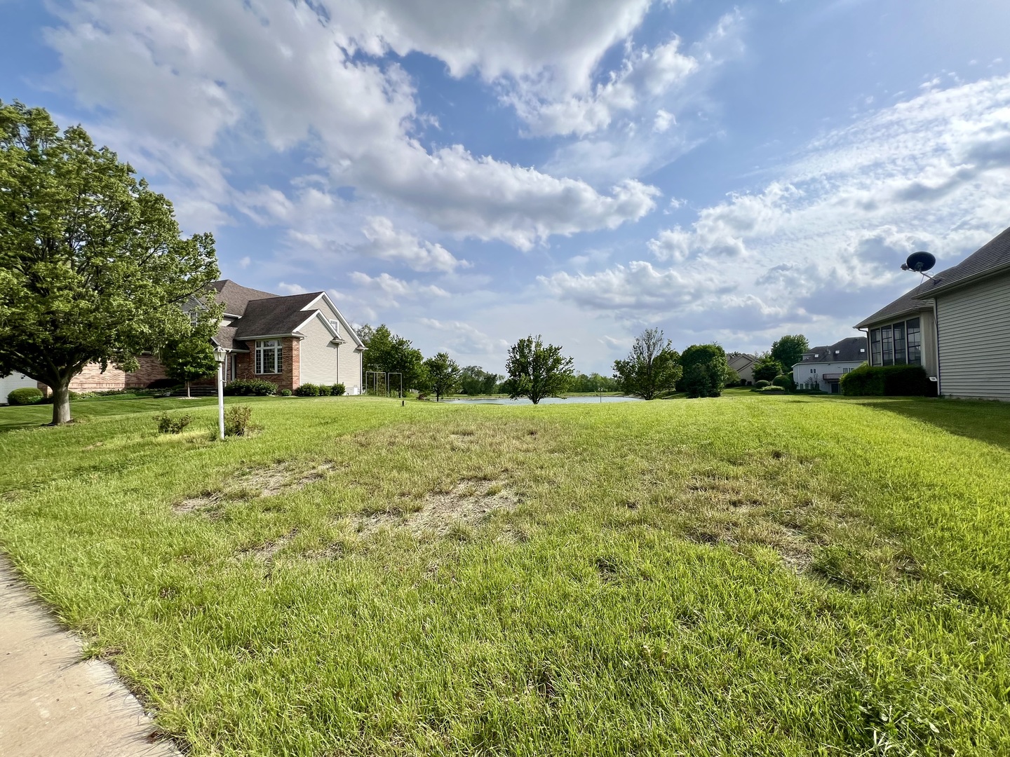 4309 Stonebridge Court Champaign, IL 61822 - Photo 5 of 8 a view of a garden with a building in the background