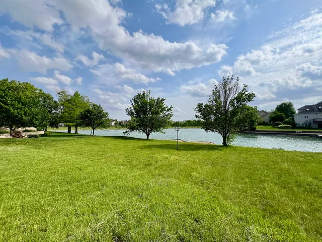 a view of a golf course with a lake