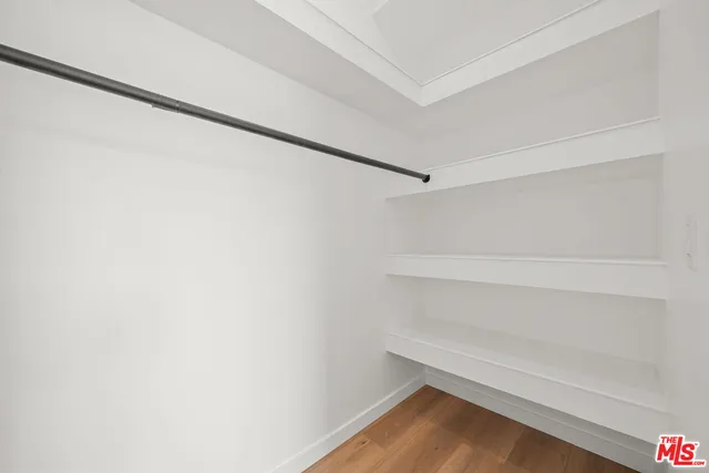 a bedroom with a bed and chair