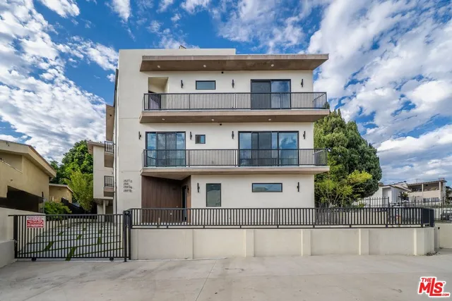 a front view of a house with a garage