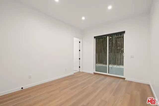 a terrace with outdoor seating and city view