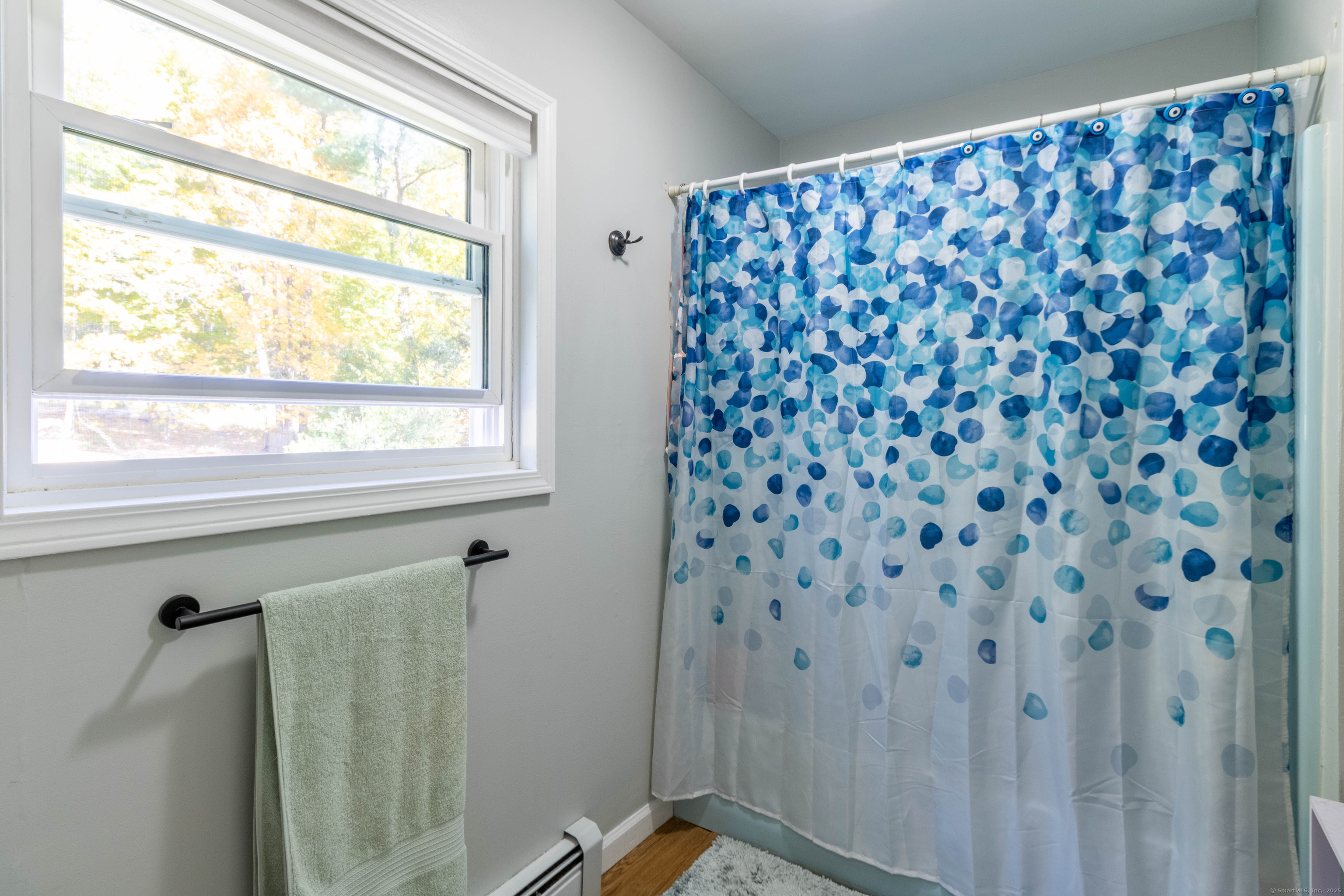 26 Firetown Road Simsbury, CT 06070 - Photo 12 of 40 a bathroom with a shower curtain