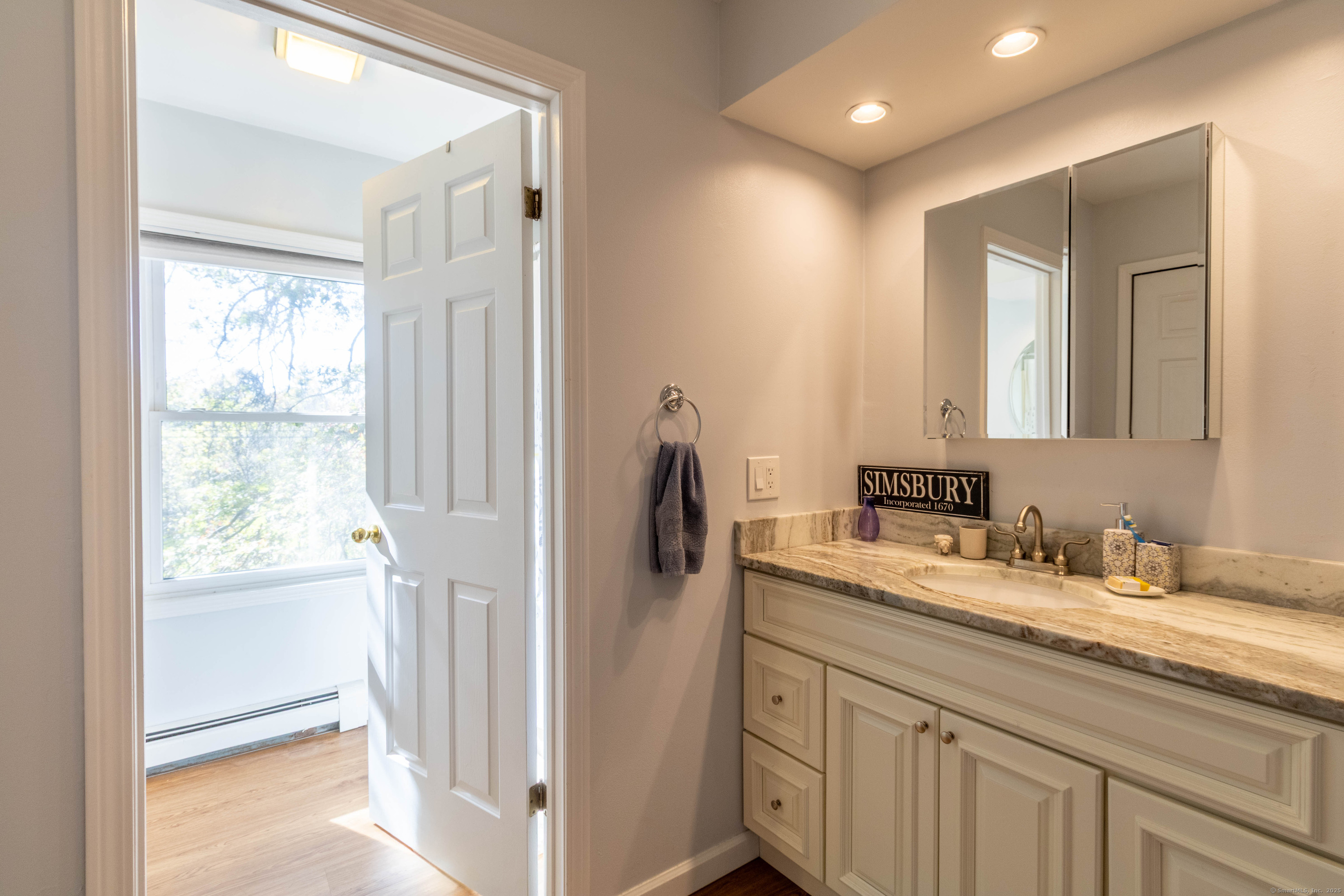 26 Firetown Road Simsbury, CT 06070 - Photo 13 of 40 a bathroom with a double vanity sink and mirror