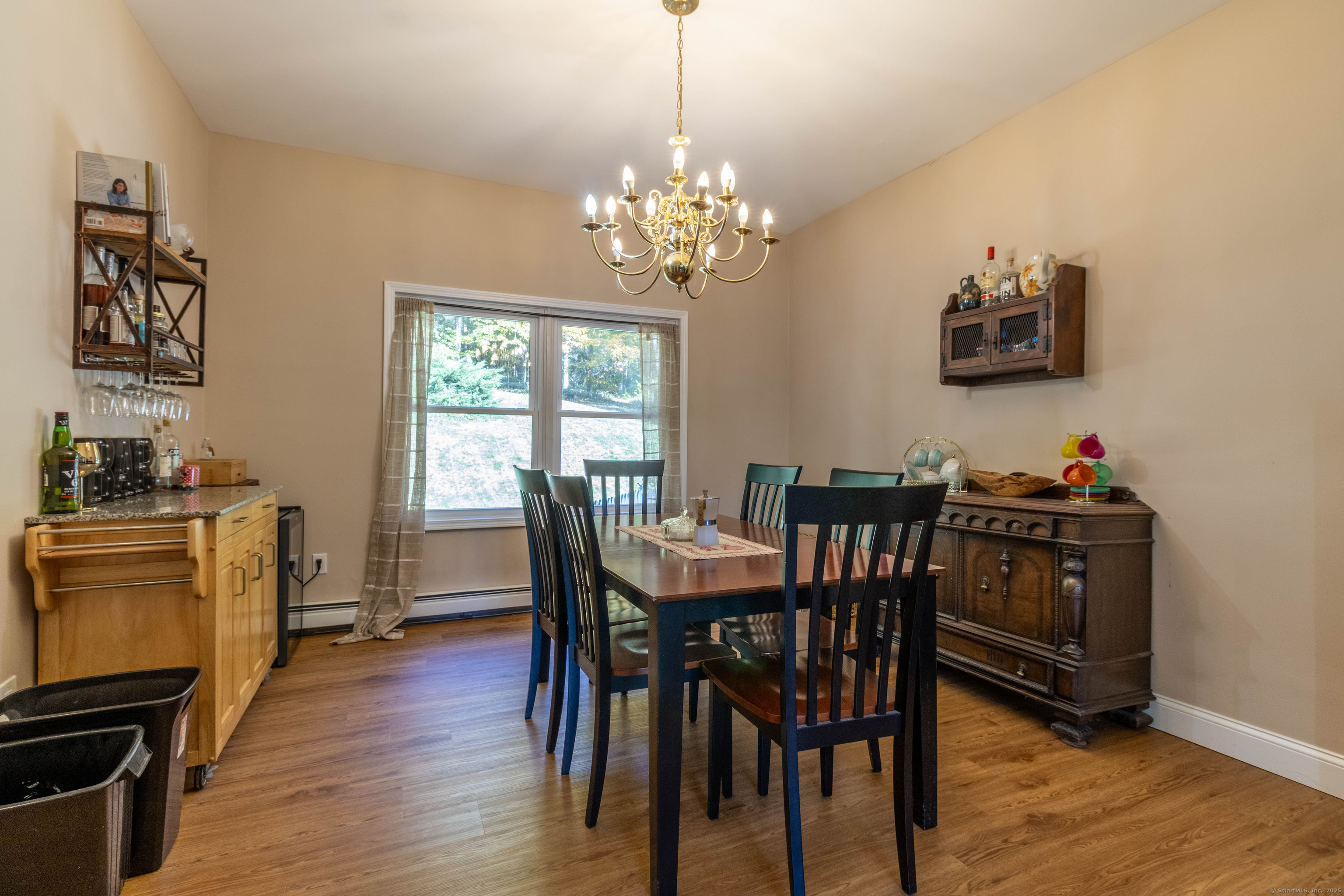 26 Firetown Road Simsbury, CT 06070 - Photo 19 of 40 a view of a dining room with furniture window and wooden floor