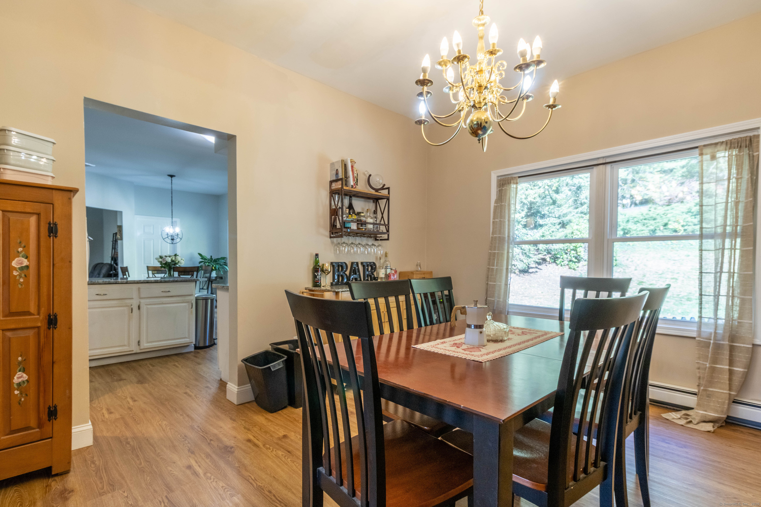 26 Firetown Road Simsbury, CT 06070 - Photo 20 of 40 a view of a dining room with furniture window and wooden floor