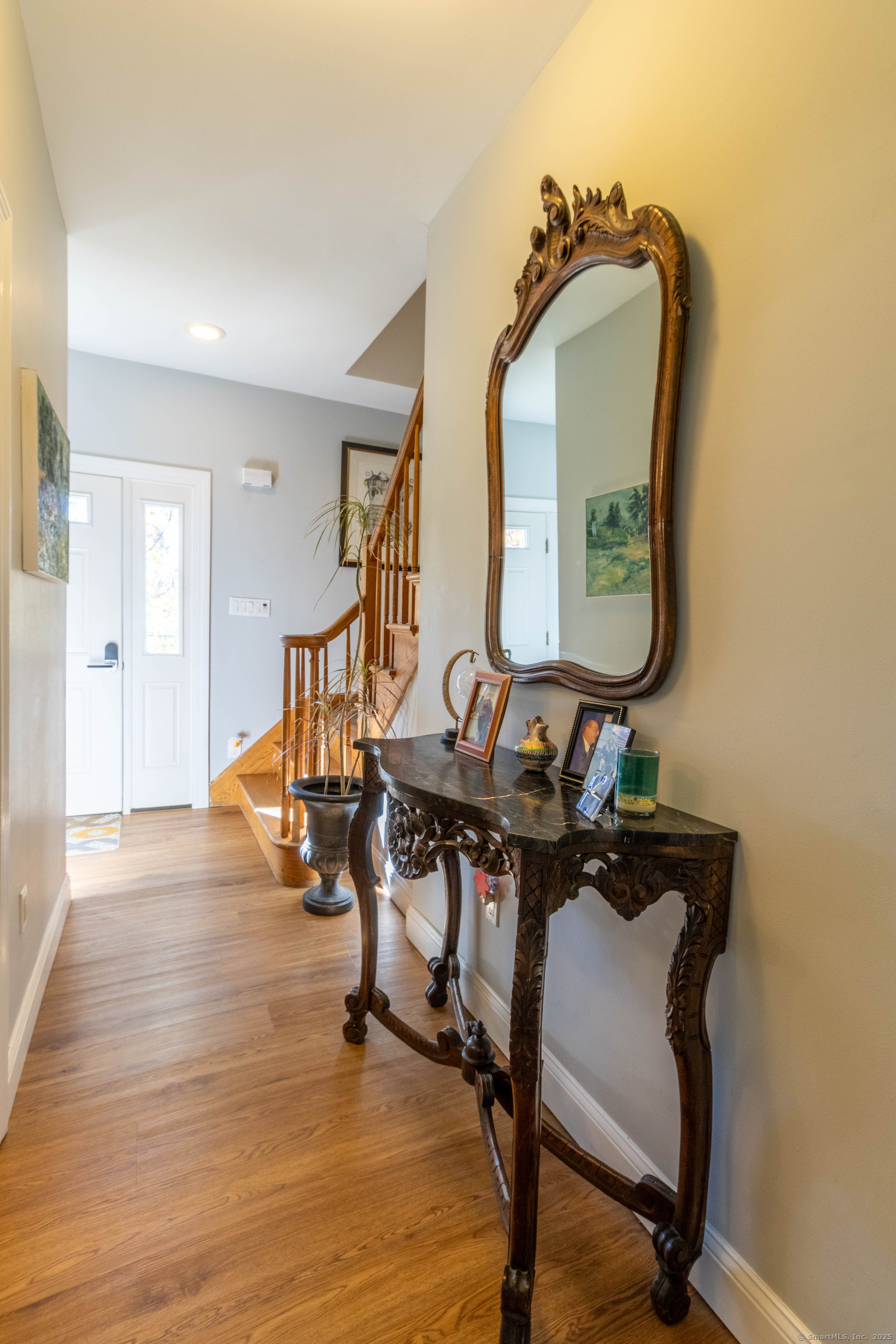 26 Firetown Road Simsbury, CT 06070 - Photo 26 of 40 a view of a livingroom with furniture and a mirror