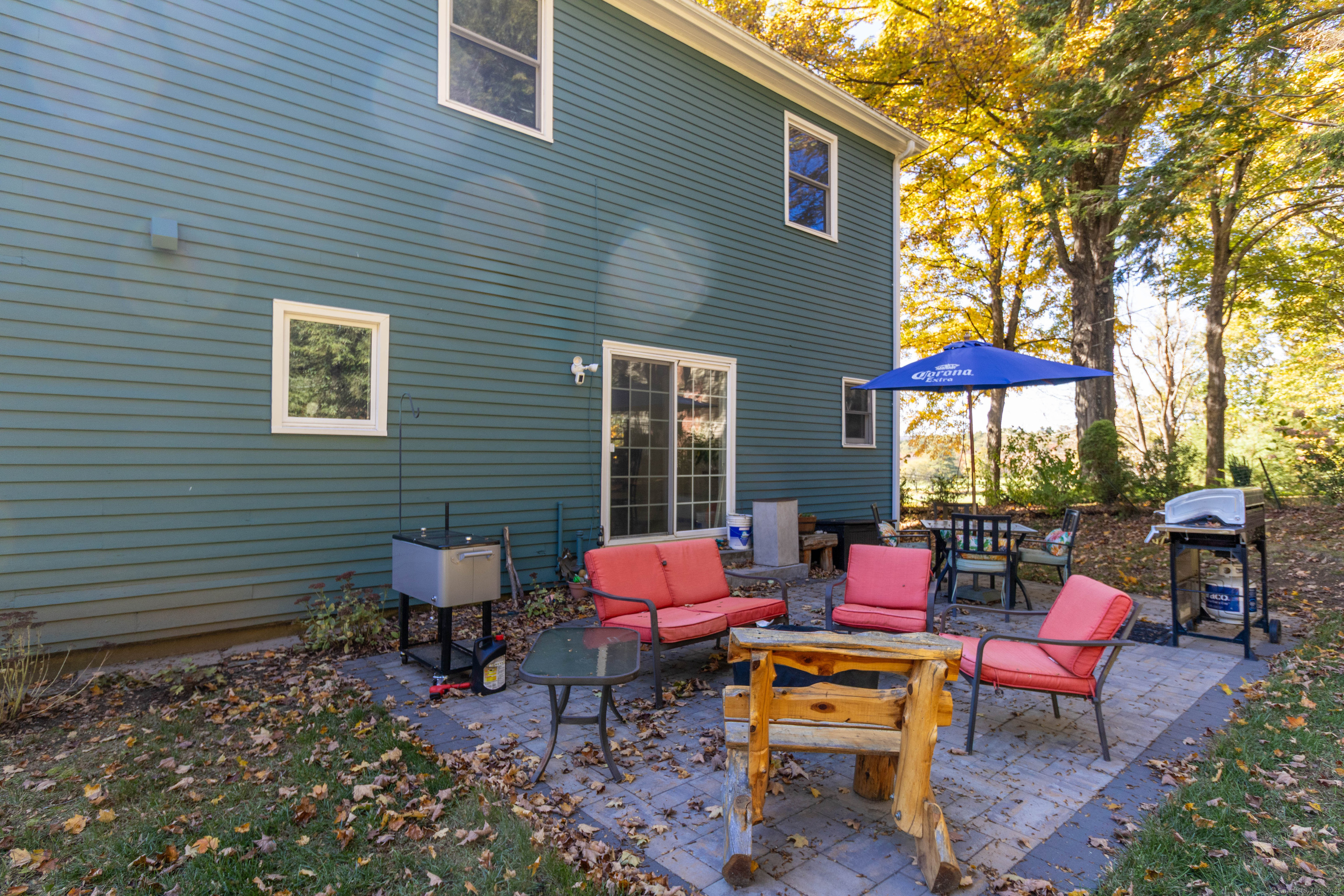 26 Firetown Road Simsbury, CT 06070 - Photo 33 of 40 a building outdoor space with furniture and umbrella