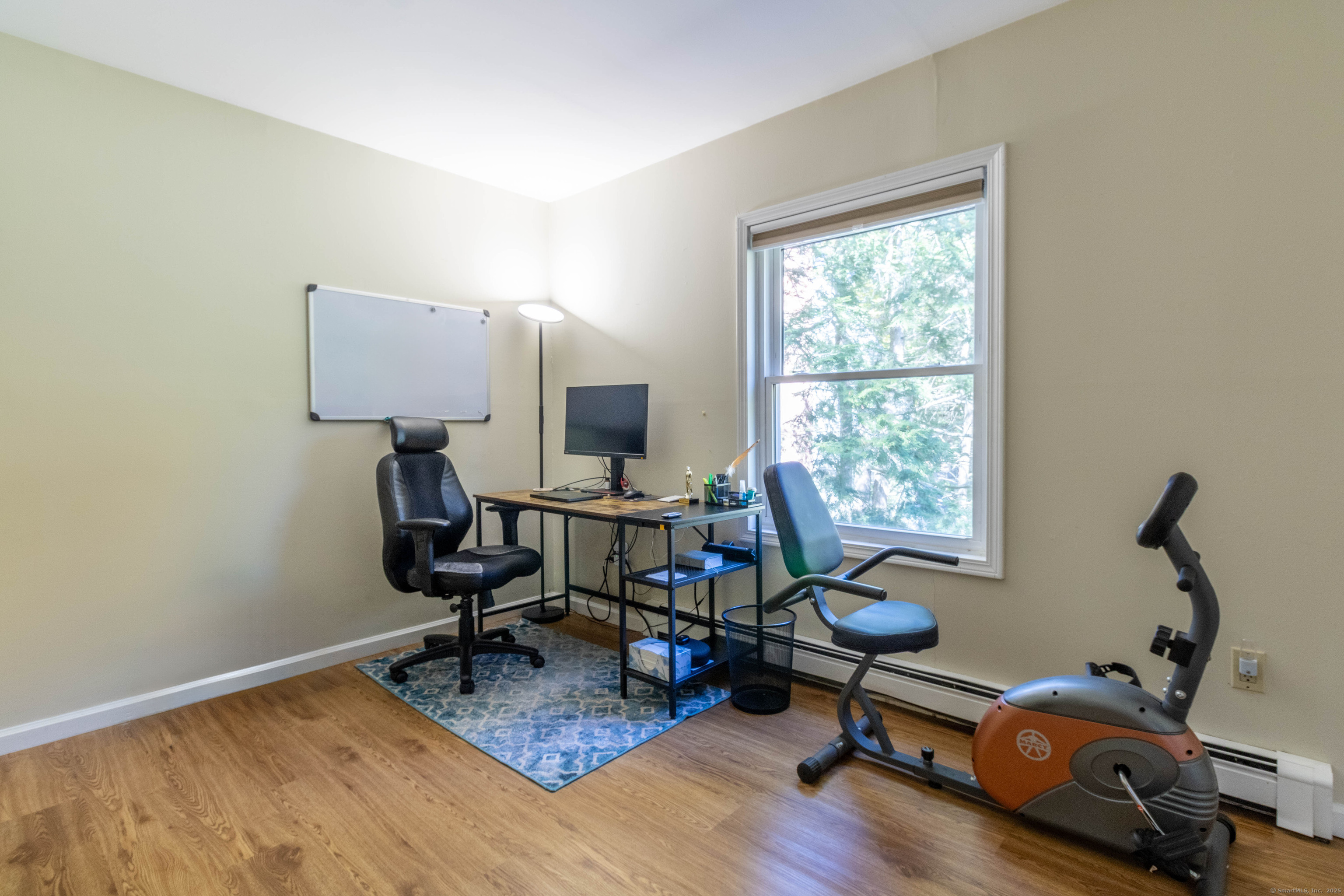 26 Firetown Road Simsbury, CT 06070 - Photo 4 of 40 a view of a workspace with furniture and a window