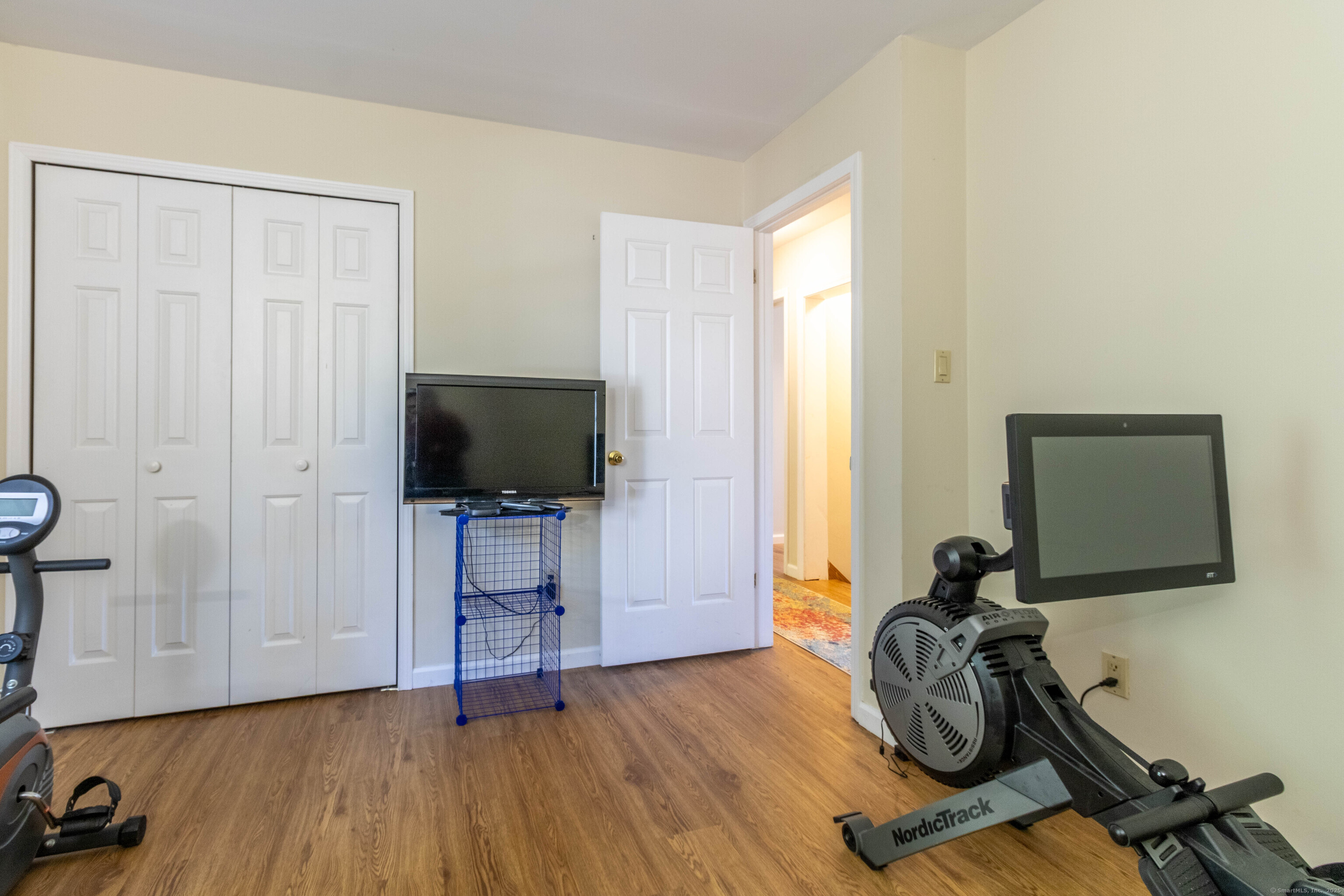 26 Firetown Road Simsbury, CT 06070 - Photo 5 of 40 a view of a workspace with furniture and a window