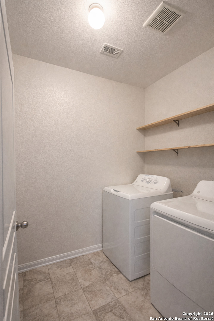 8949 Elizabeth Park Converse, TX 78109 - Photo 19 of 35 a utility room with dryer and washer