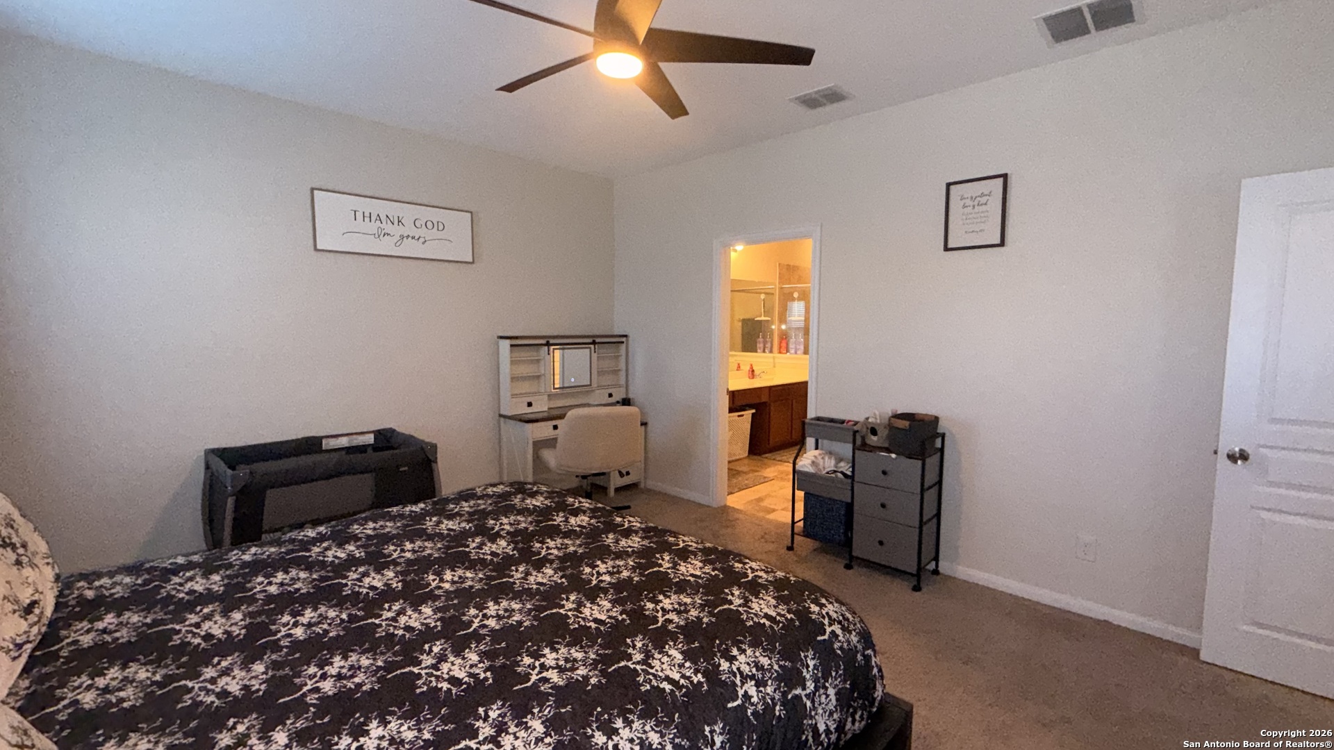 8949 Elizabeth Park Converse, TX 78109 - Photo 20 of 35 a bedroom with a bed and wooden floor