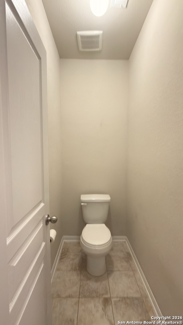 8949 Elizabeth Park Converse, TX 78109 - Photo 24 of 35 a bathroom with a toilet and a shower