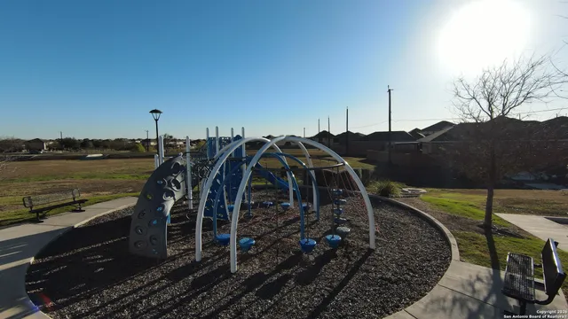 a view of a patio with table and chairs with wooden floor