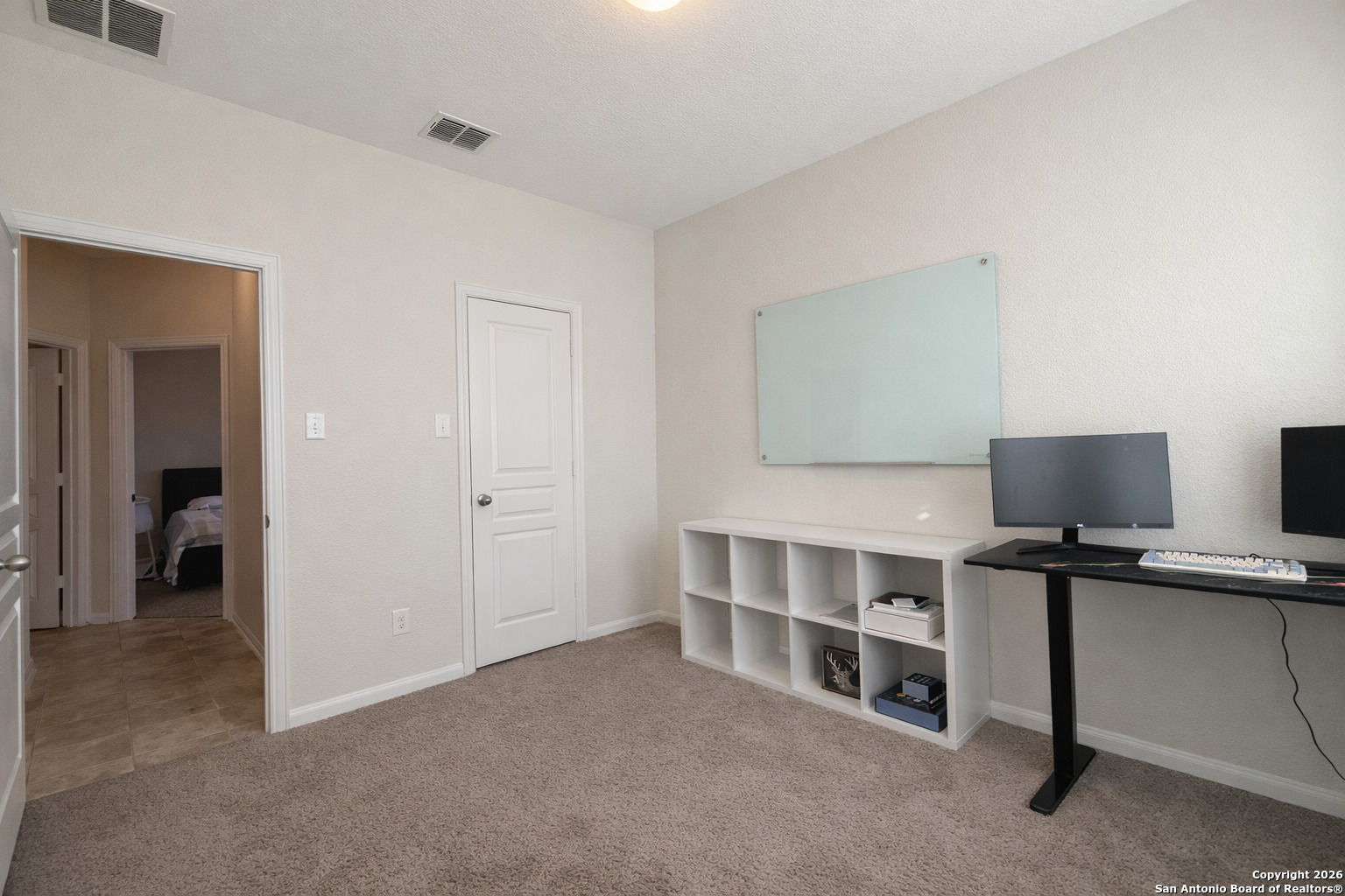 8949 Elizabeth Park Converse, TX 78109 - Photo 4 of 35 a view of a bedroom with workspace