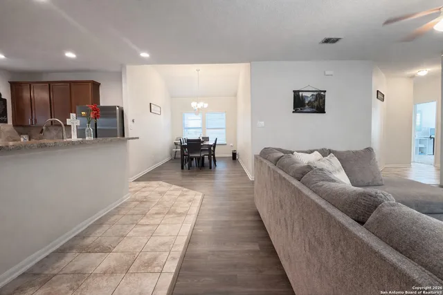 a living room with furniture and a table