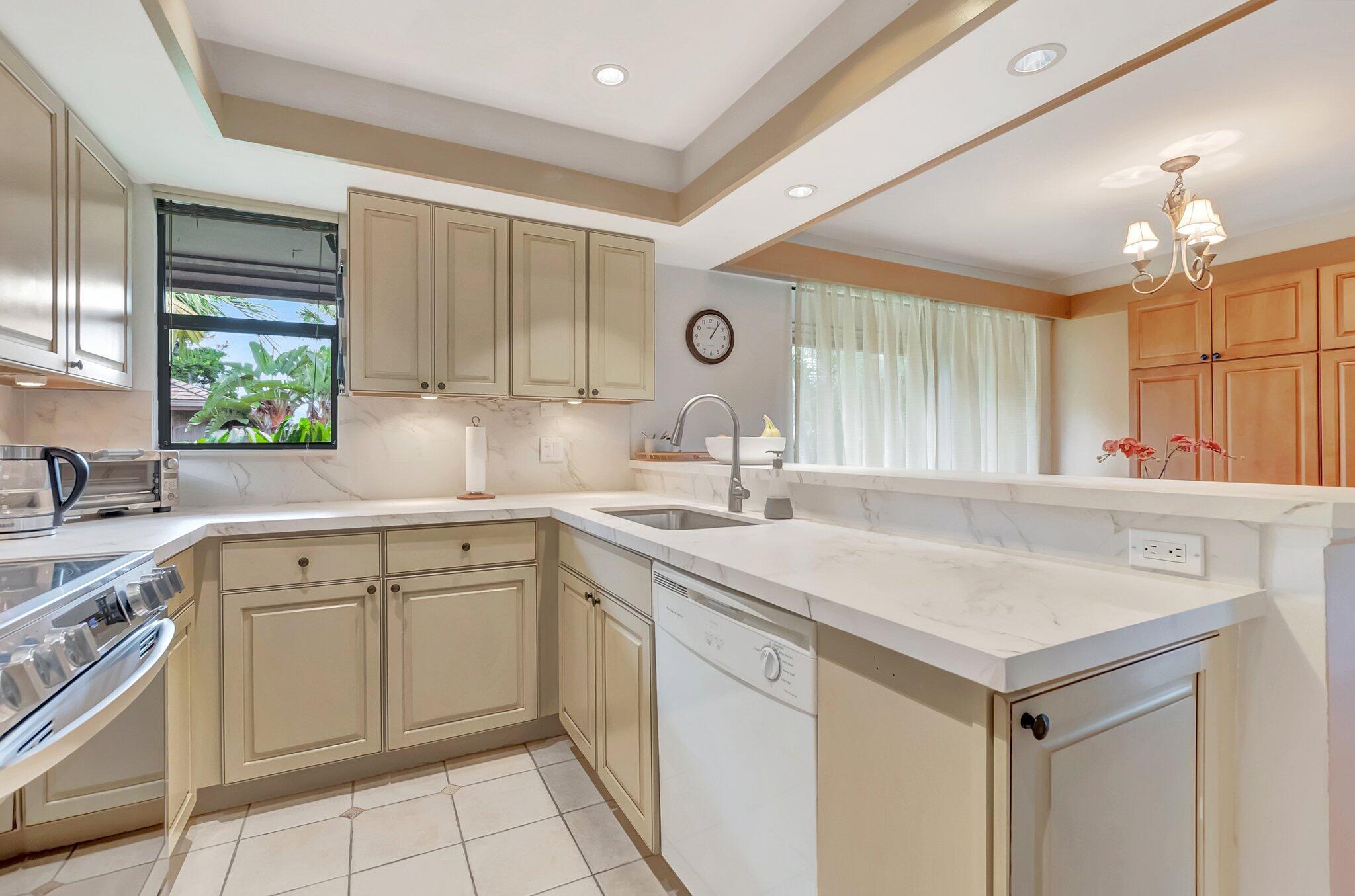 7067 Rain Forest Drive Boca Raton, FL 33434 - Photo 13 of 32 a kitchen with a sink cabinets and window