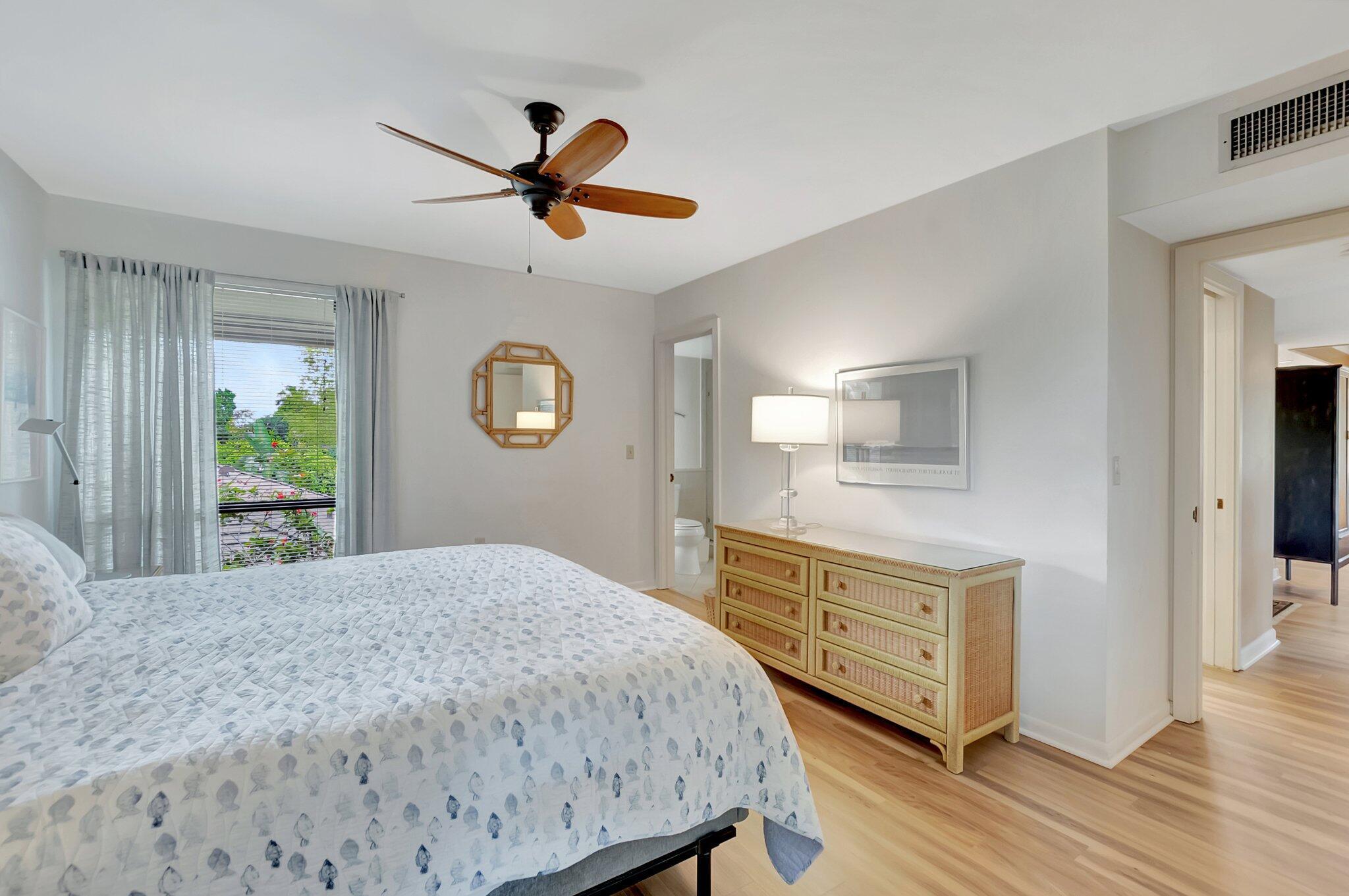 7067 Rain Forest Drive Boca Raton, FL 33434 - Photo 15 of 32 a bedroom with a bed and a dresser