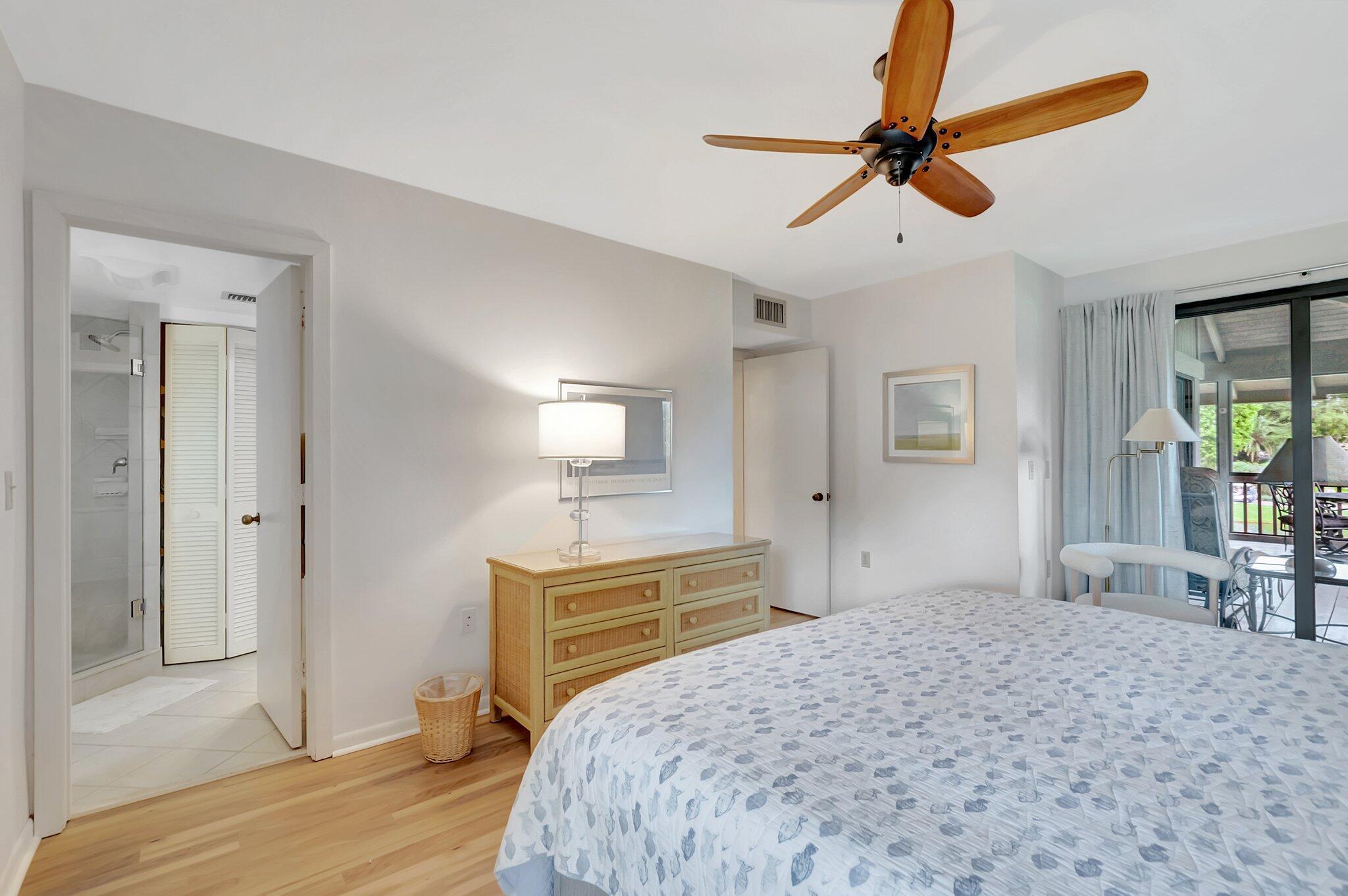 7067 Rain Forest Drive Boca Raton, FL 33434 - Photo 16 of 32 a bedroom with a bed and a dresser