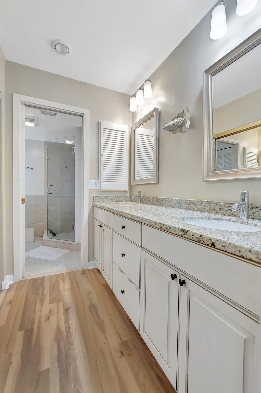 7067 Rain Forest Drive Boca Raton, FL 33434 - Photo 18 of 32 a bathroom with a granite countertop double vanity sink and mirror