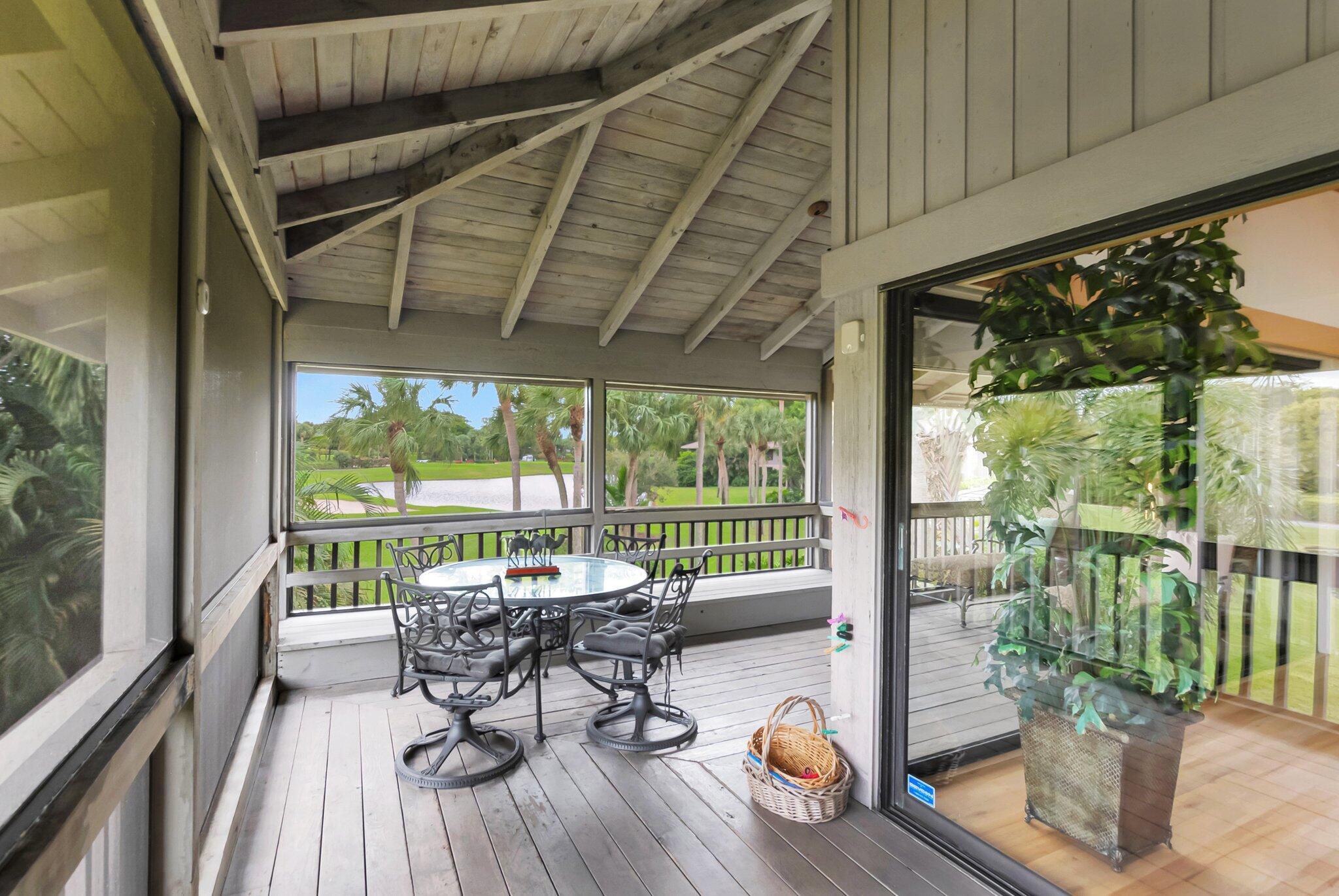 7067 Rain Forest Drive Boca Raton, FL 33434 - Photo 24 of 32 a view of a patio with wooden floor