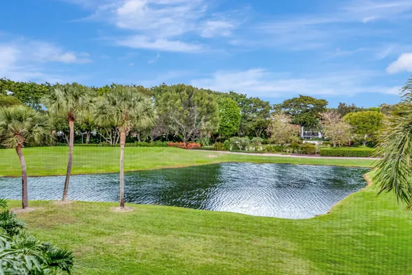 a view of a field with sitting area