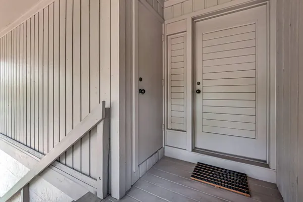 a view of a porch with wooden floor