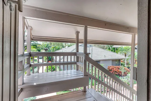 a view of a two chairs in the balcony