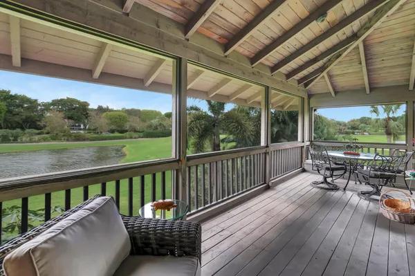 a view of a chairs in wooden deck