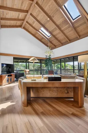 a view of living room with furniture and floor to ceiling window