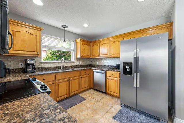 a dining room with furniture water view and wooden floor