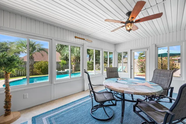 a en suite bathroom with a granite countertop double vanity sink and a mirror