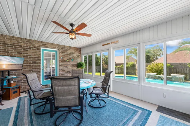 a bedroom with a bed wooden floor and furniture