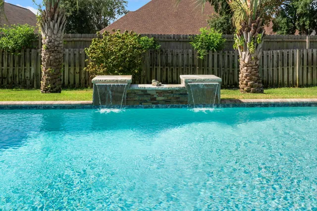 a view of a house with backyard and porch