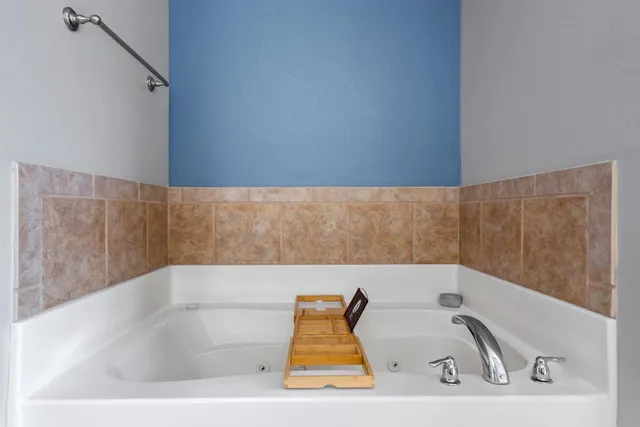a bathroom with a sink double vanity and a mirror