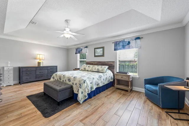 a white toilet sitting next to a bath tub shower