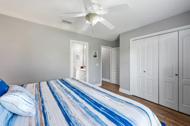 a street sign on a sidewalk next to a road