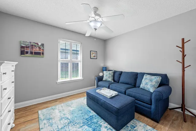 a front view of a house with a yard and glass windows